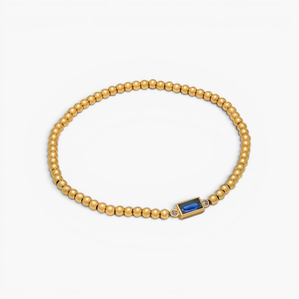 Bracelet doré à perles et pierre de naissance