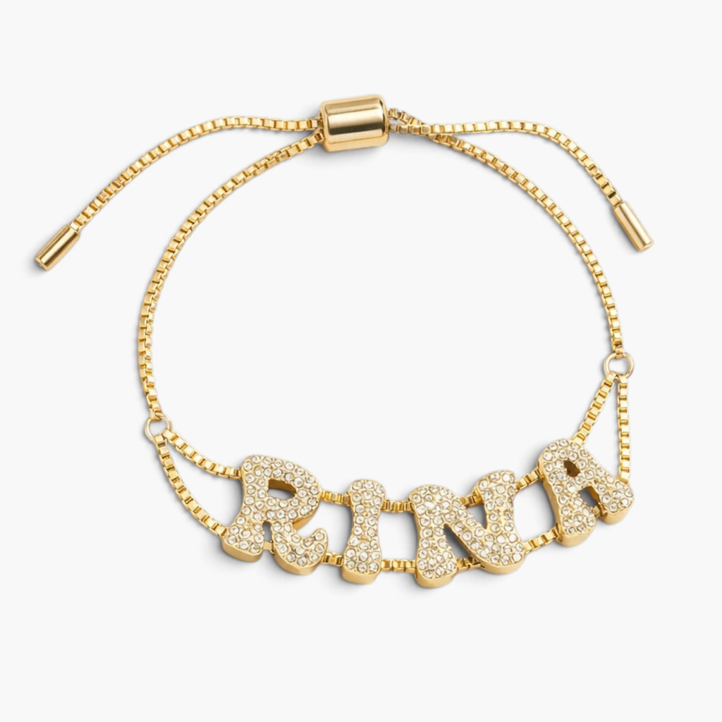 Pulsera dorada con nombre y letra pavé