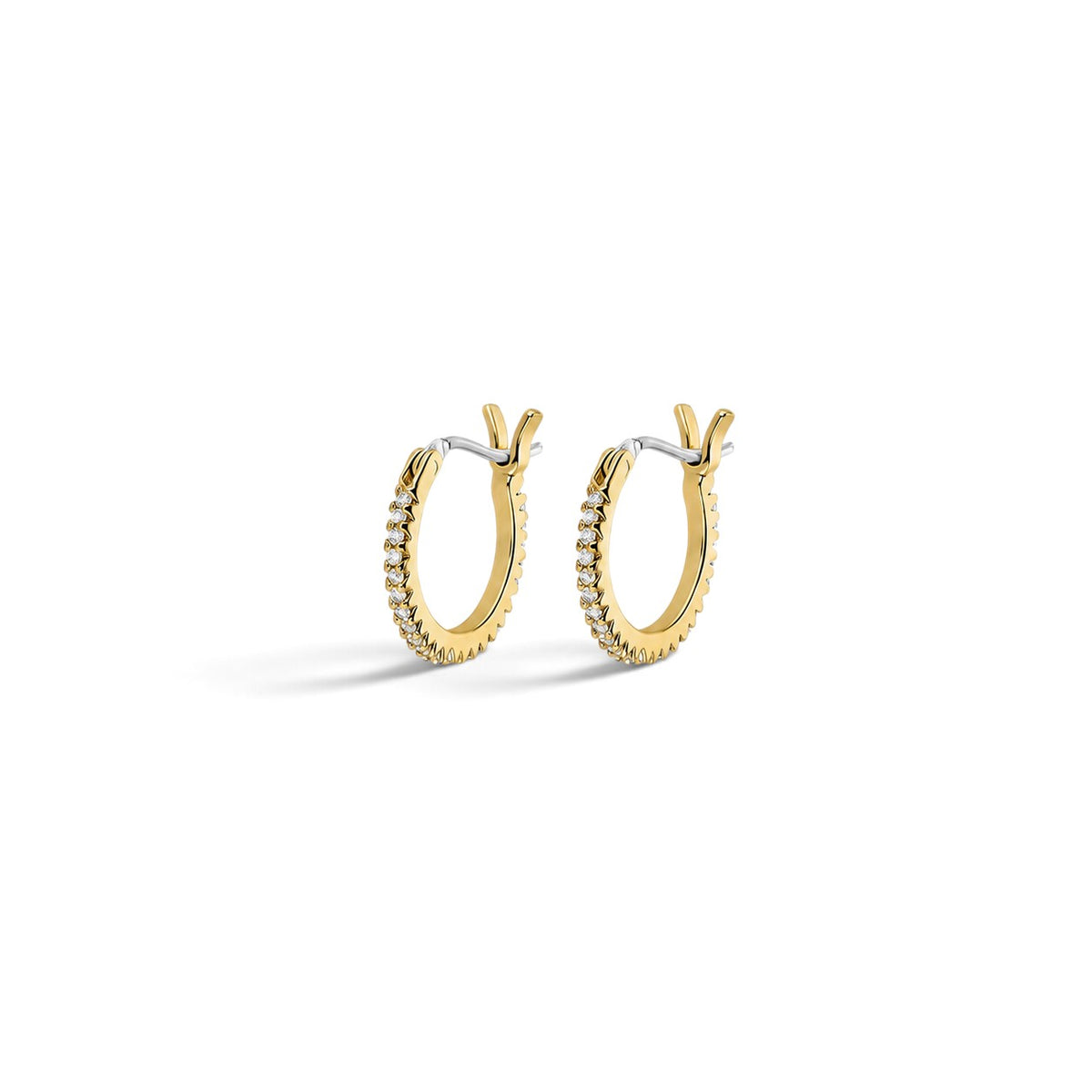 Evervanta gold huggie hoop earrings featuring a row of sparkling cubic zirconia stones on a white background.