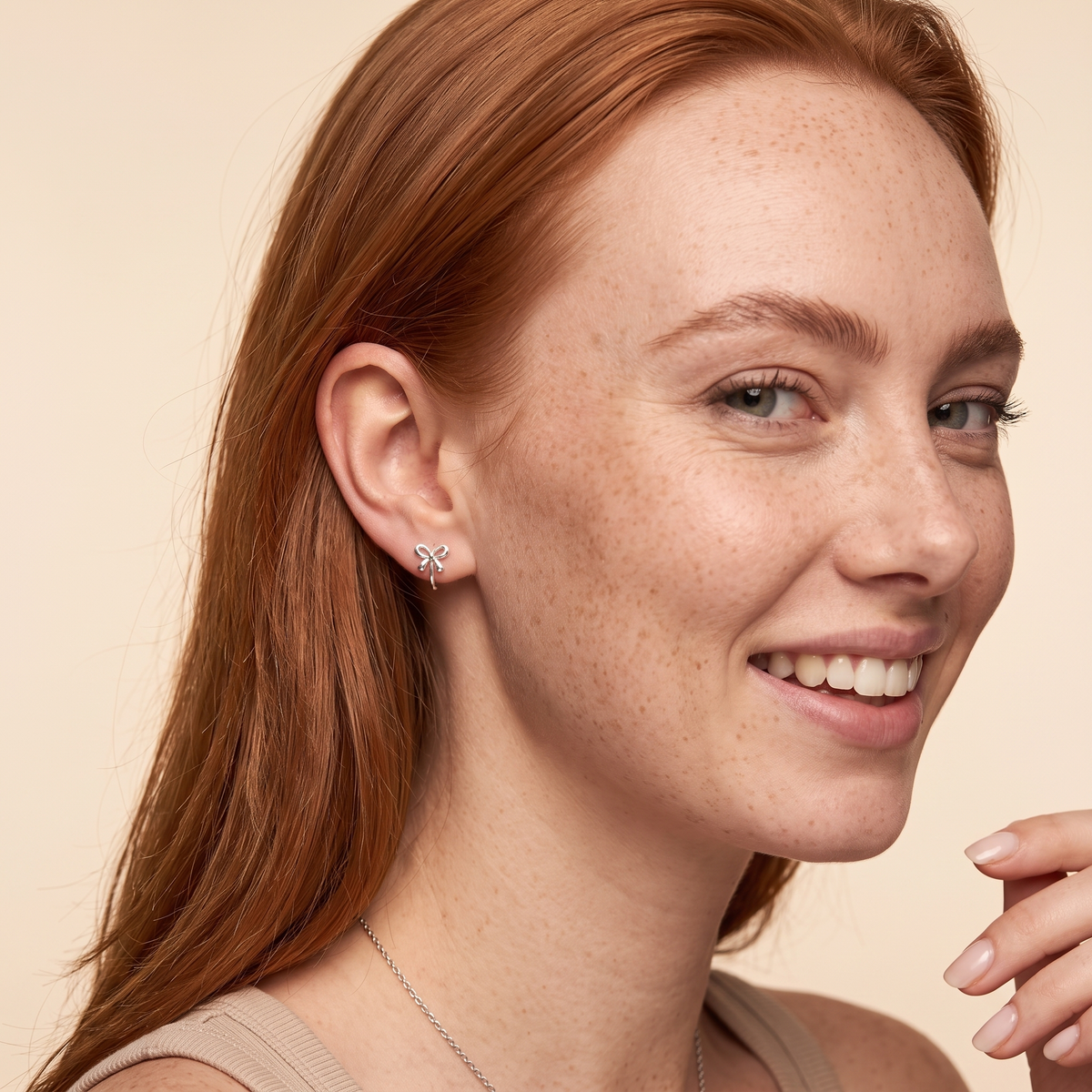 Bow Mini Hoop Earrings - worn