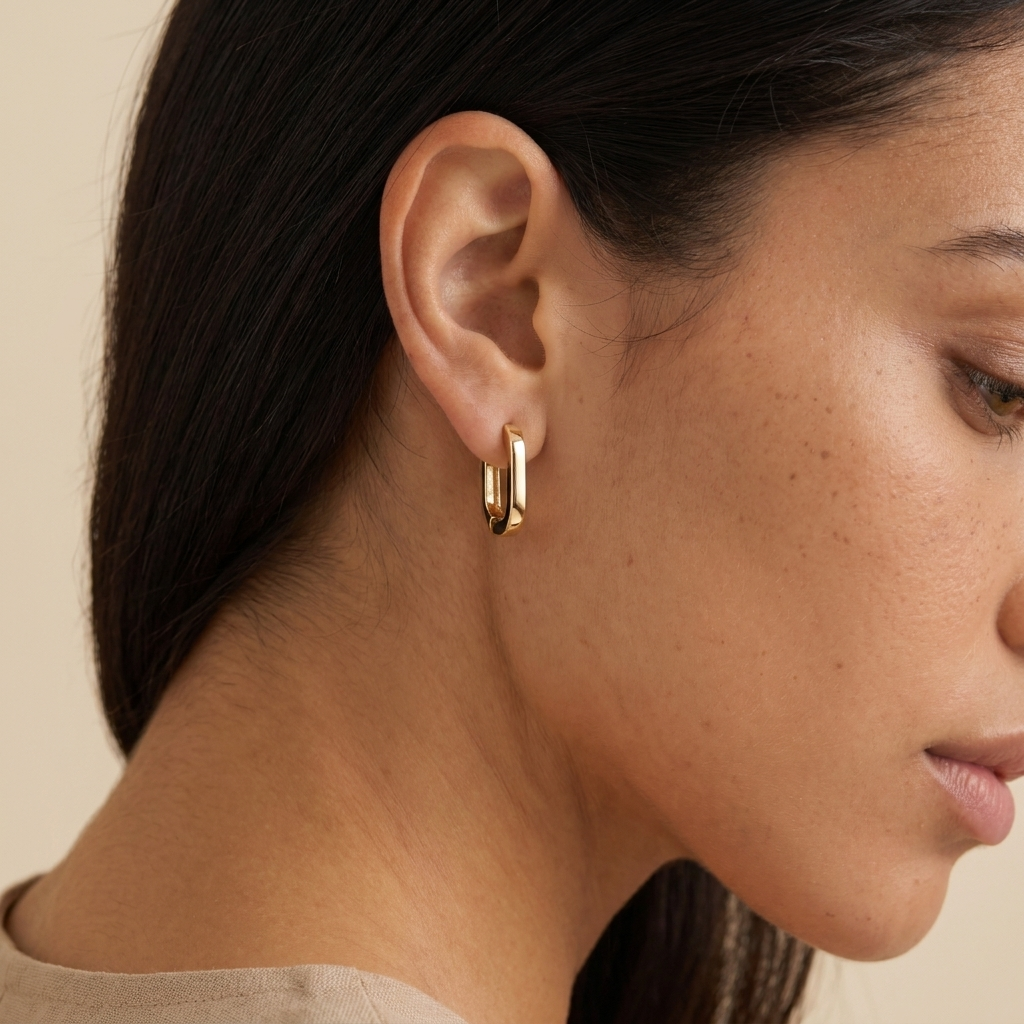 Oval Huggie Hoop Earrings - Gold - close-up